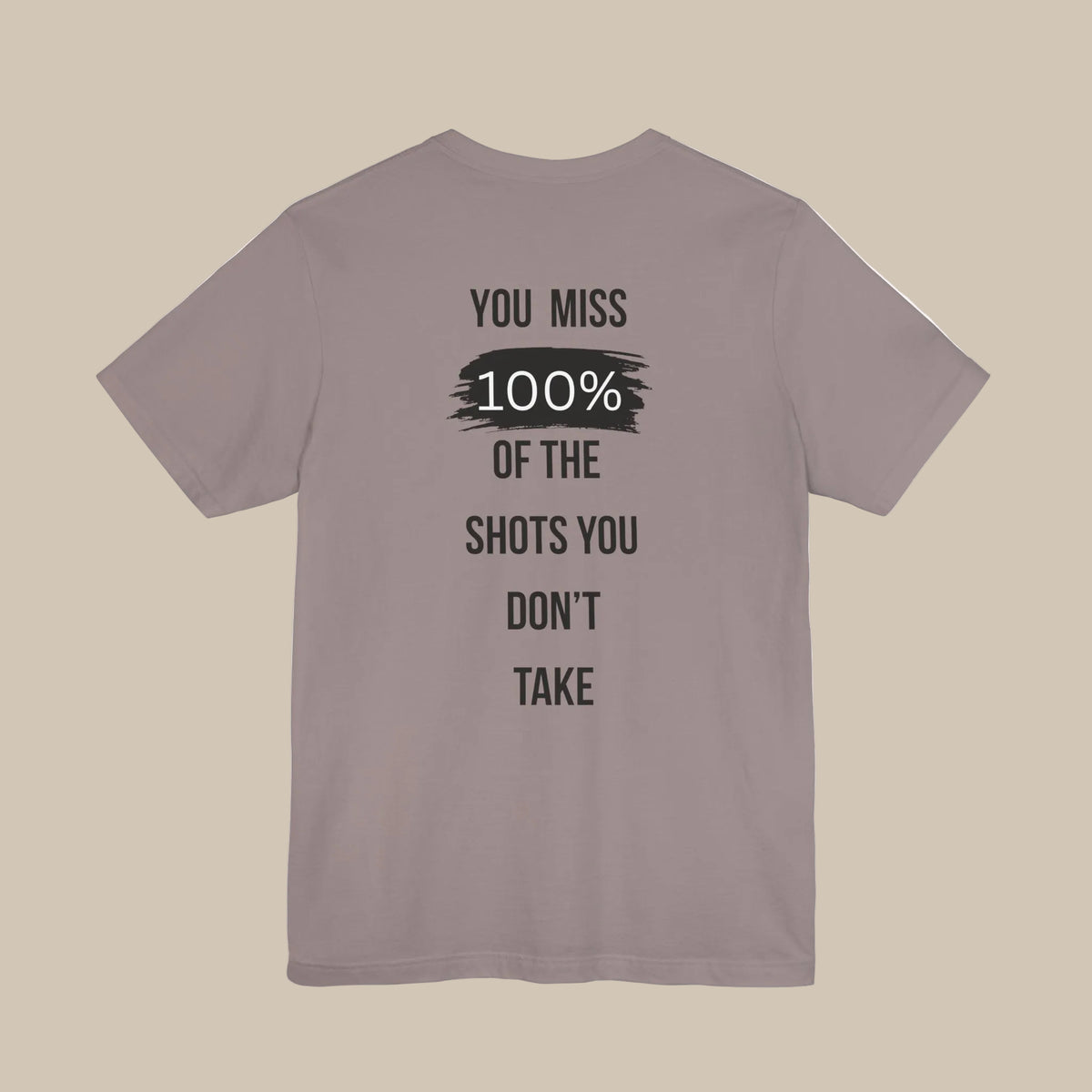 Brown gray gym t-shirt with motivational quote on the back against a brown gray background