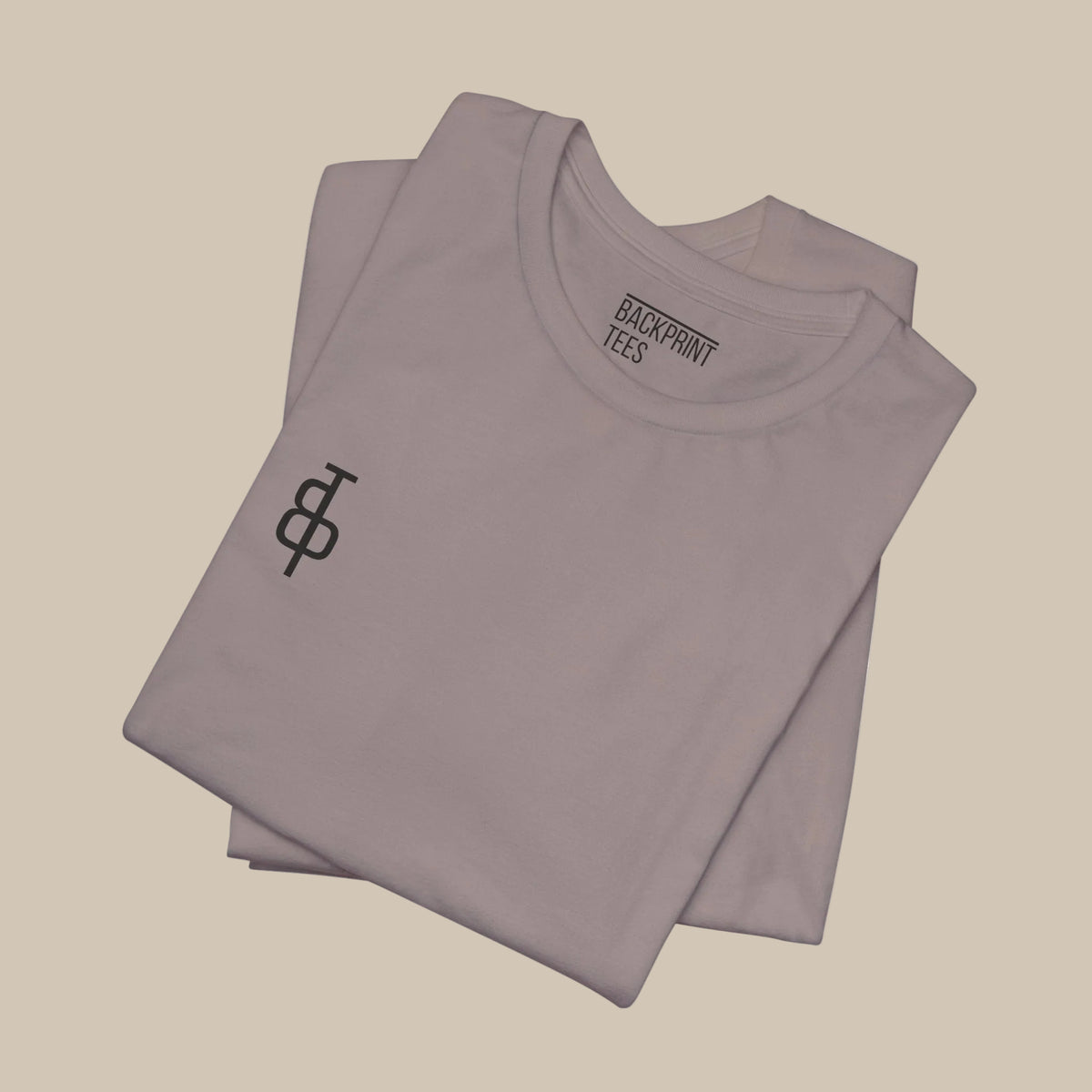 Folded brown gray gym t-shirt with motivational quote on the back against a brown gray background
