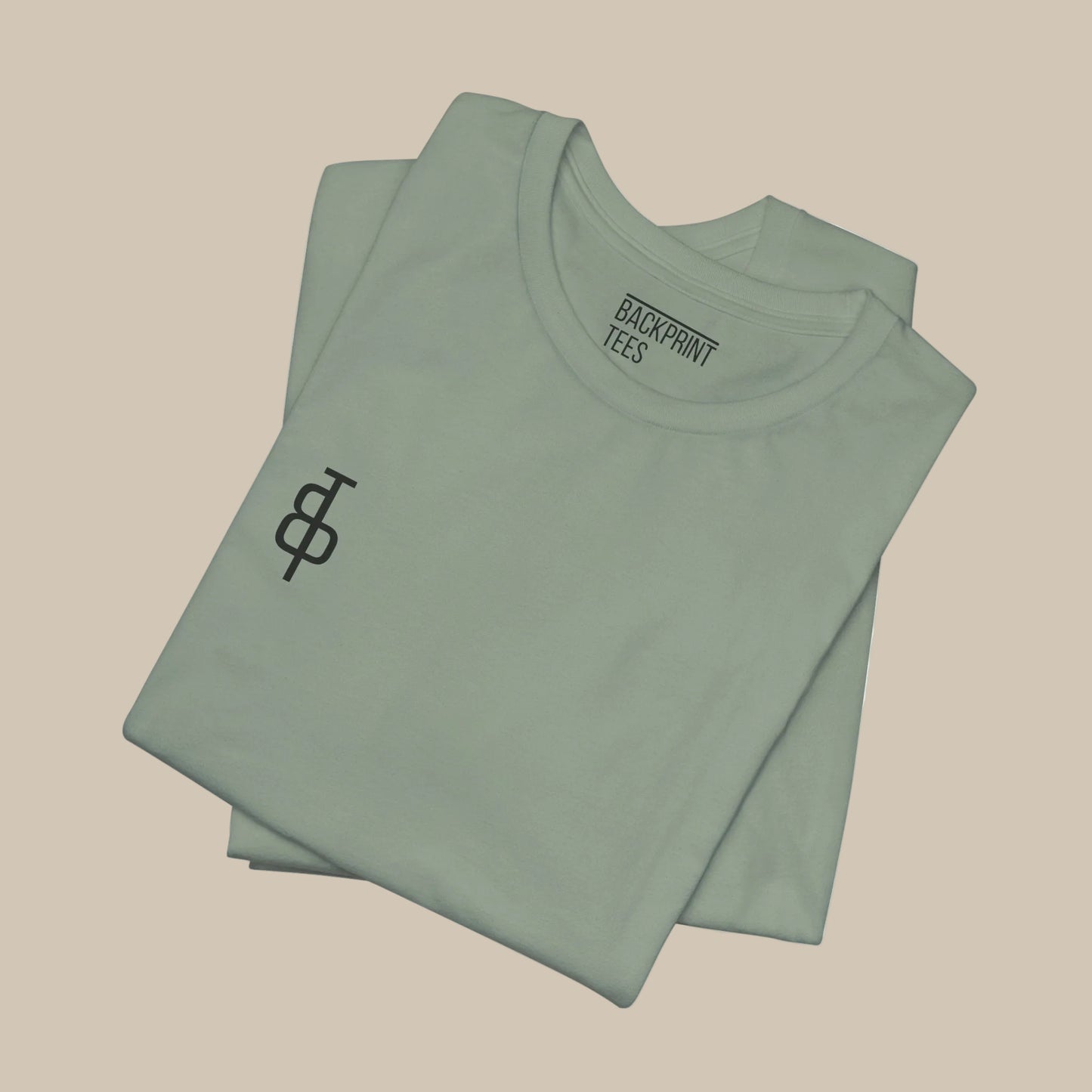 Folded light green gym t-shirt with a logo on a green background