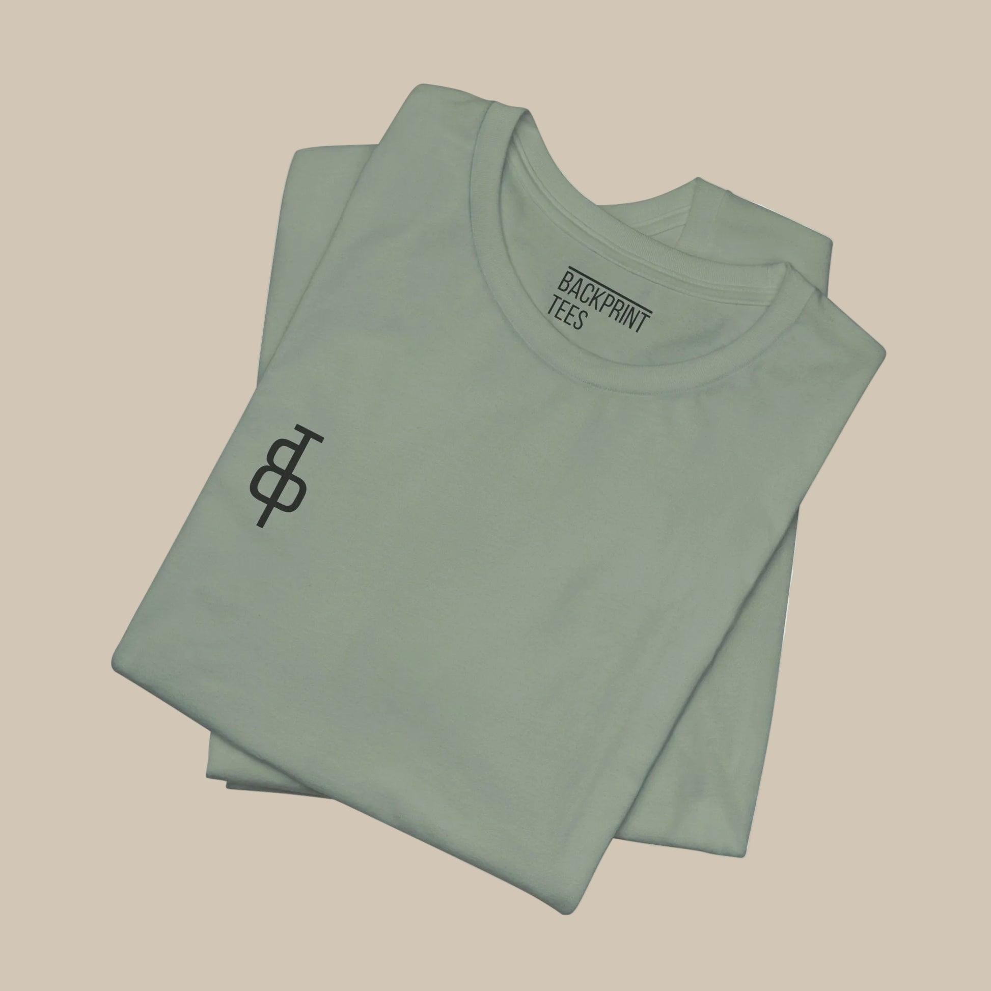Folded light green gym t-shirt with a logo on a green background
