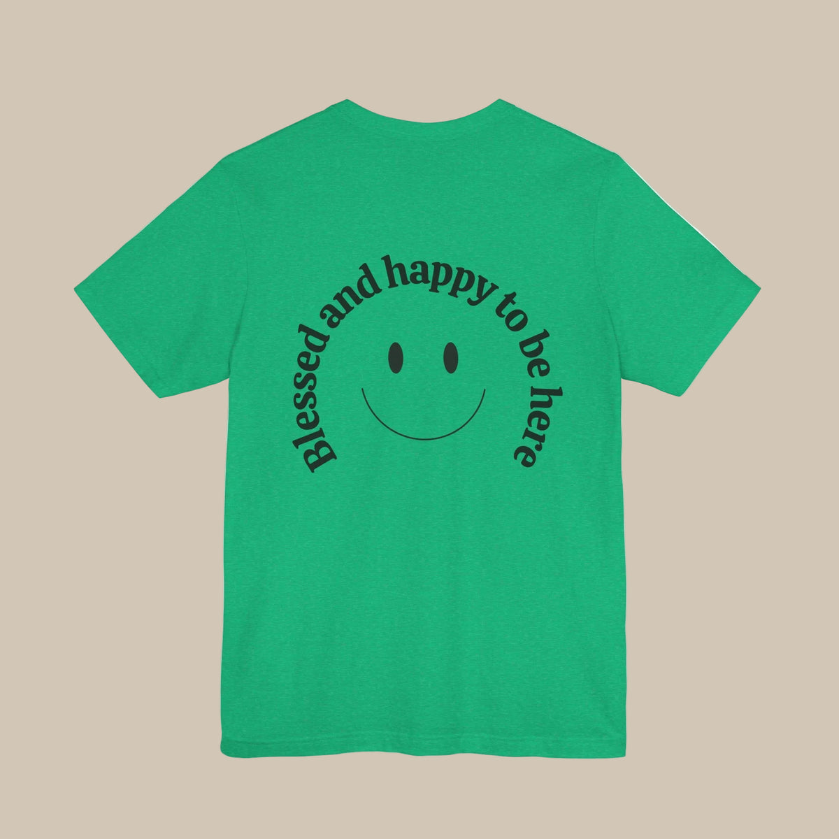 Green t-shirt with a smiley face and backprint text against a green background
