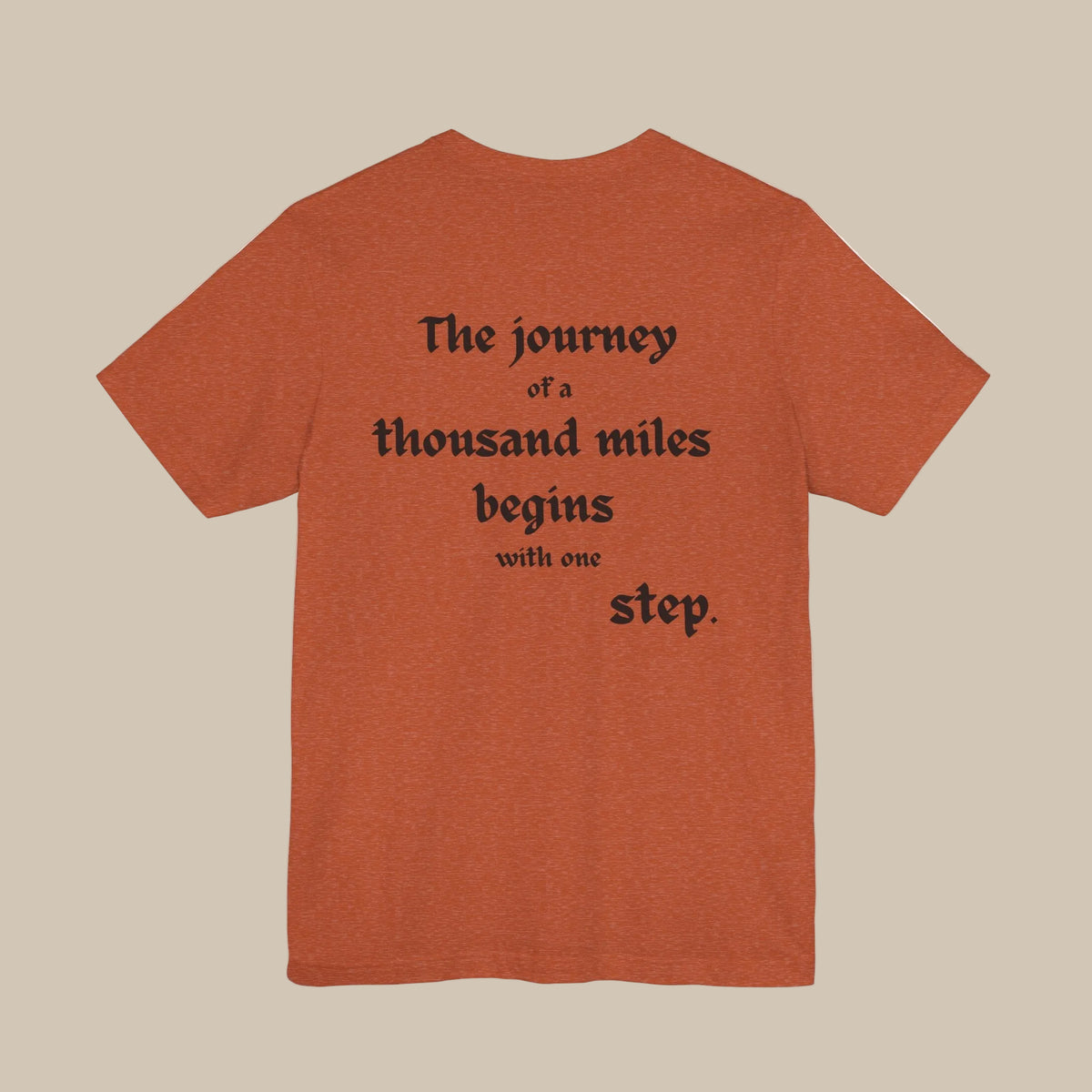 Orange t-shirt with black text backprint on a orange background