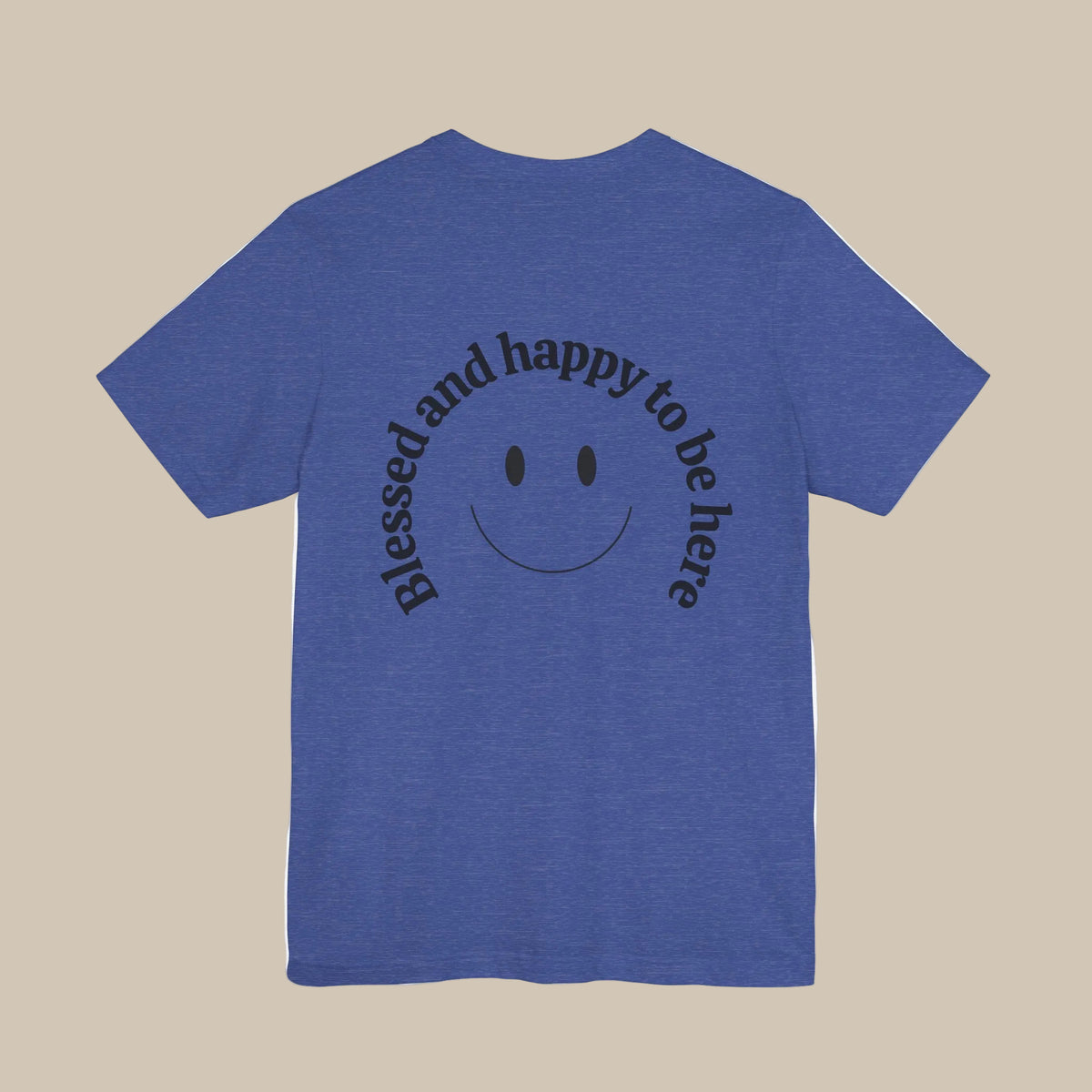 Blue t-shirt with a smiley face and backprint text on the back against a blue background
