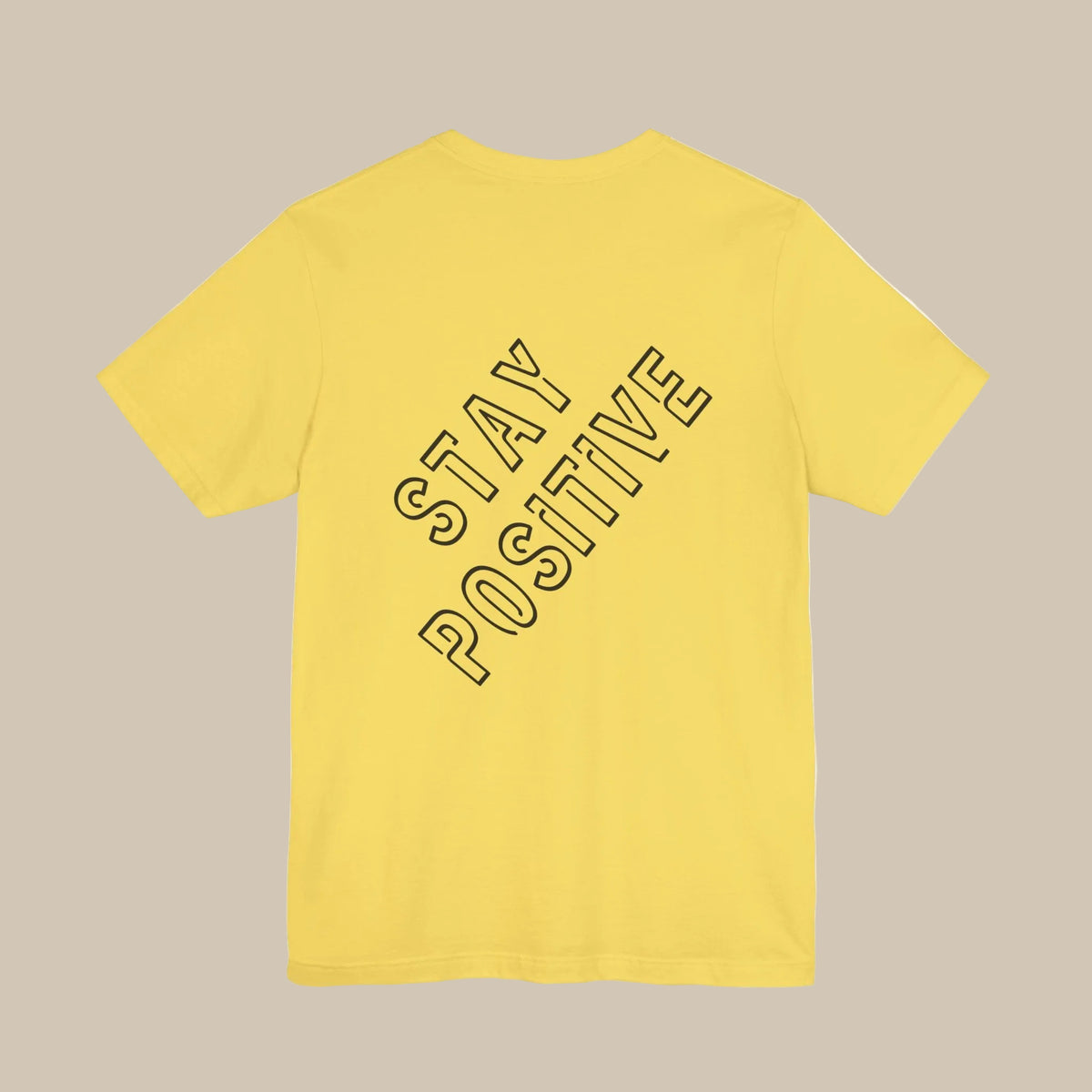 Yellow t-shirt with 'Stay Positive' backprint text on a yellow background