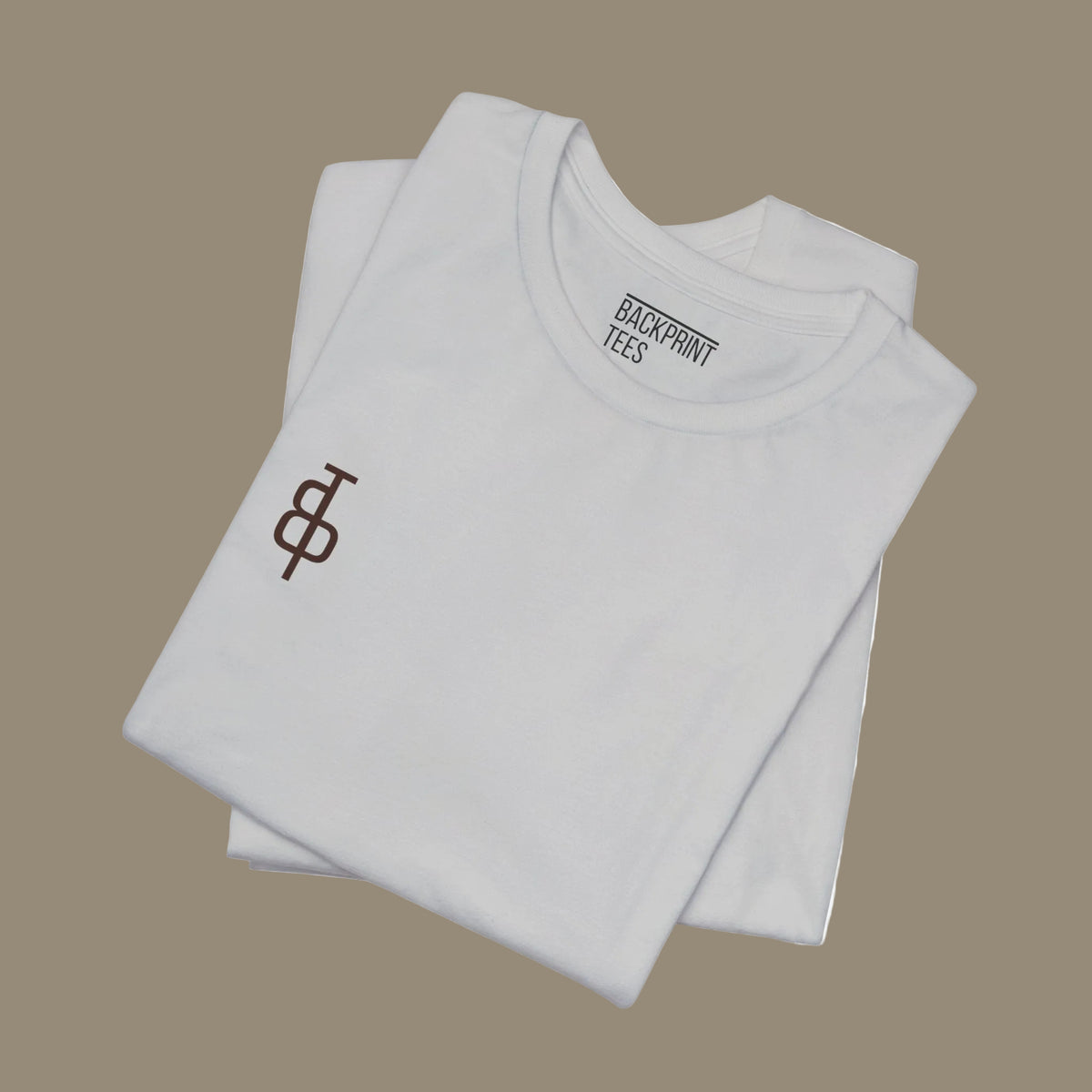 Stack of gray t-shirts with a logo and text on a gray background