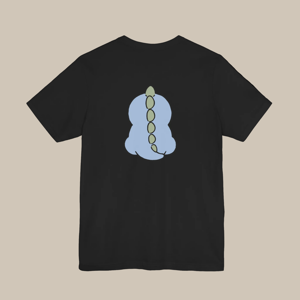Black backprint t-shirt with a kawaii dinosaur graphic on a black background