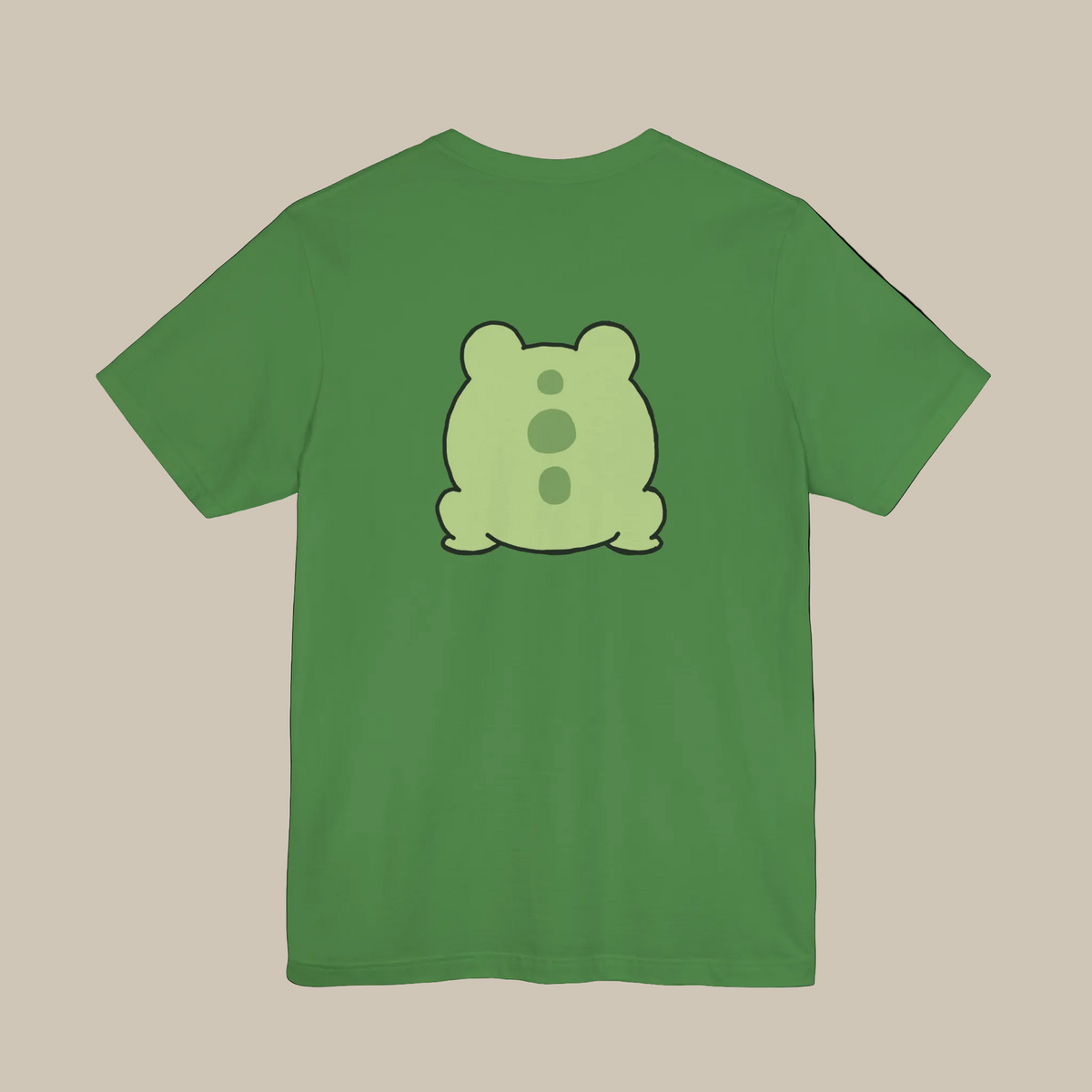 Green backprint t-shirt with a kawaii frog graphic on a green background