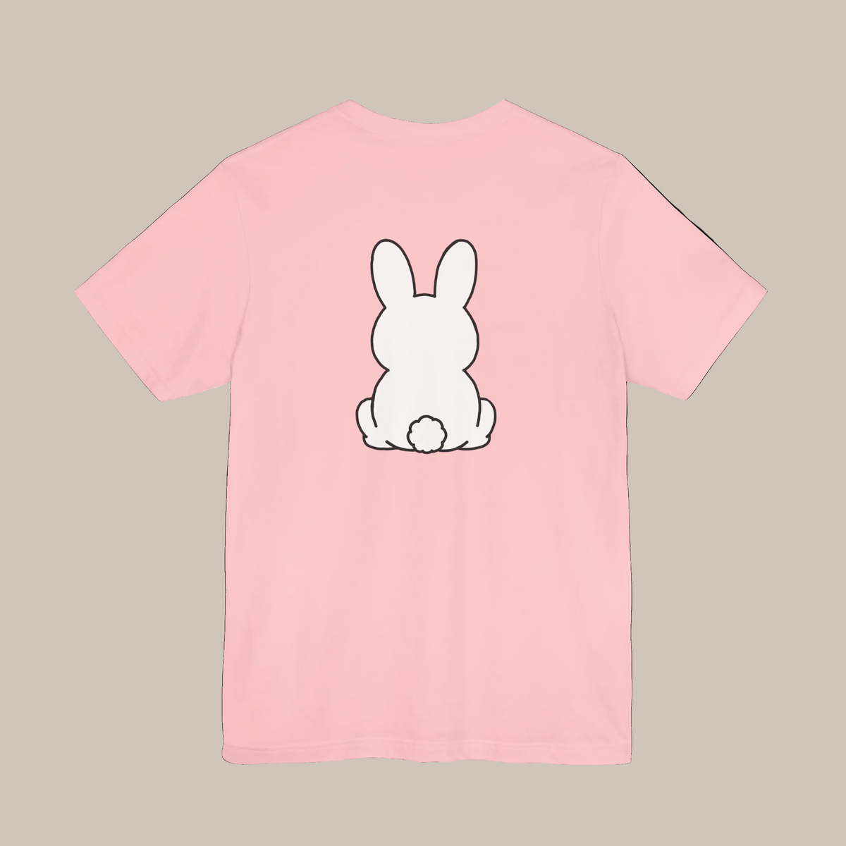 Pink backprint t-shirt with a kawaii bunny graphic on a pink background